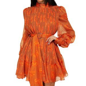 Orange floral pleated dress with belt.